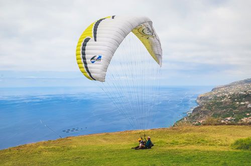Paraglider over Arco da Calheta, Madeira